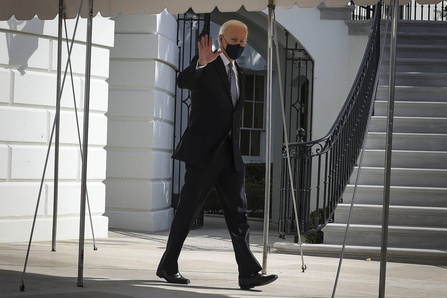 March 19, 2021, Washington, District of Columbia, USA: United States President Joe Biden waves to the press as he walks on the South Lawn of the White House before boarding Marine One on March 19, 202 ...