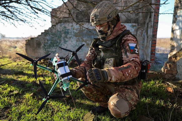 RUSSIA, KHERSON REGION - JANUARY 12, 2025: A serviceman of a Russian Army Group Dnepr mechanised infantry regiment combat drone unit is seen during a combat mission in the zone Russia s special milita ...