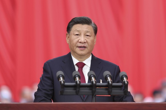 In this photo released by Xinhua News Agency, Chinese President Xi Jinping delivers a speech during the opening ceremony of the 20th National Congress of China's ruling Communist Party in Beijing, Chi ...
