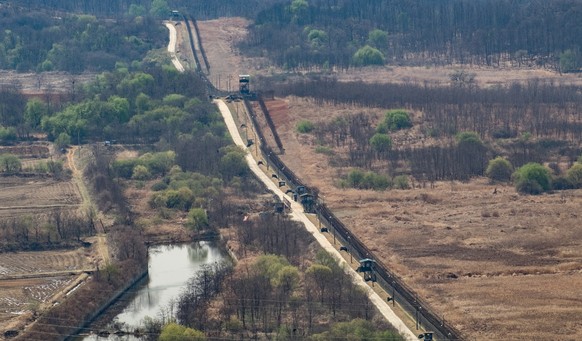 Korean demilitarized zone with border fences between South Korea (left) and North Korea (right)