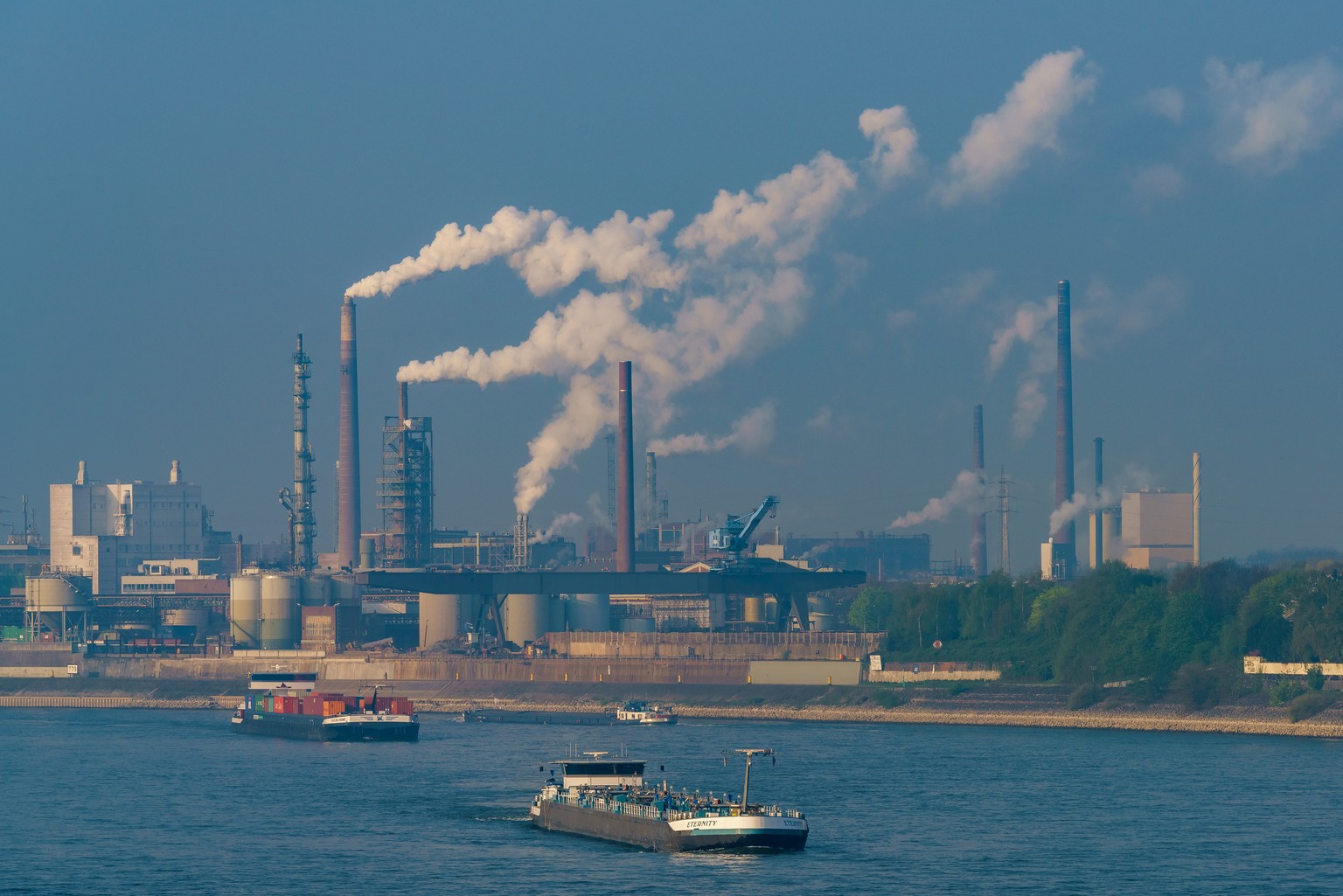 Duisburg, North Rhine-Westphalia, Germany - April 09, 2017: View over Duisburg and the river Rhine with some ships, seen from Ruhrort