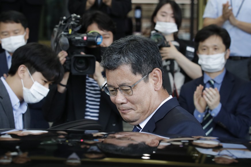 South Korean Unification Minister Kim Yeon Chul gets into a car as he leaves the government complex in Seoul, South Korea, Friday, June 19, 2020. South Korean President Moon Jae-in on Friday accepted  ...