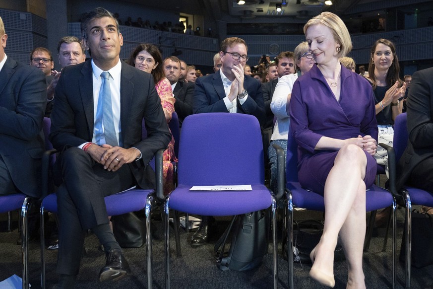 FILE - Liz Truss, right, looks across with Rishi Sunak at left, at the Queen Elizabeth II Centre in London, Monday Sept. 5, 2022. Sunak ran for Britain’s top job and lost. Now he’s back with a second  ...