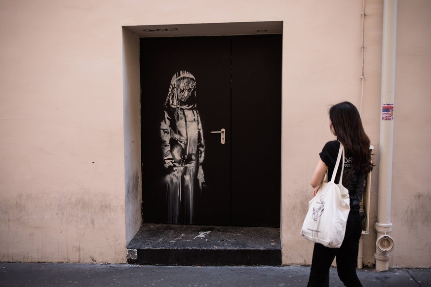 A recent artwork by street artist Banksy in Paris on June 26th, 2018, on a side street to the Bataclan concert hall where a terrorist attack killed 90 people on Novembre 13, 2015. The mysterious Briti ...