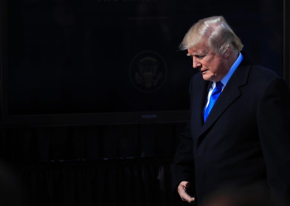 President Donald Trump walks to the podium to address participants of the annual March for Life event, in the Rose Garden of the White House in Washington, Friday, Jan. 19, 2018. (AP Photo/Manuel Balc ...