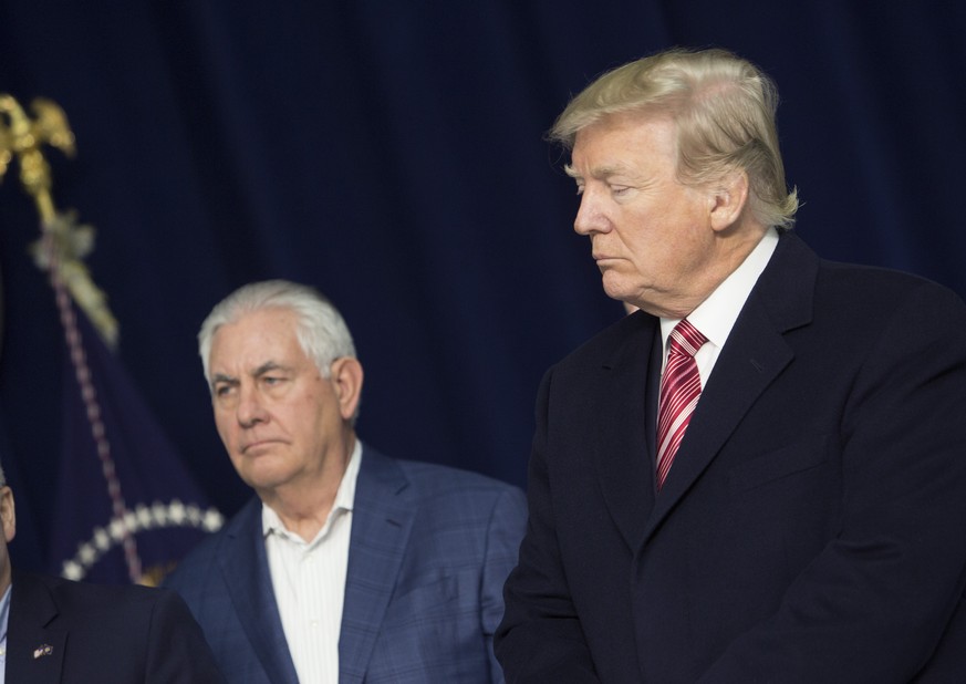 THURMONT, MD - JANUARY 6: (AFP OUT) U.S. Secretary of State Rex Tillerson and U.S. President Donald Trump listen as Republicans take turns speaking to the media at Camp David on January 6, 2018 in Thu ...