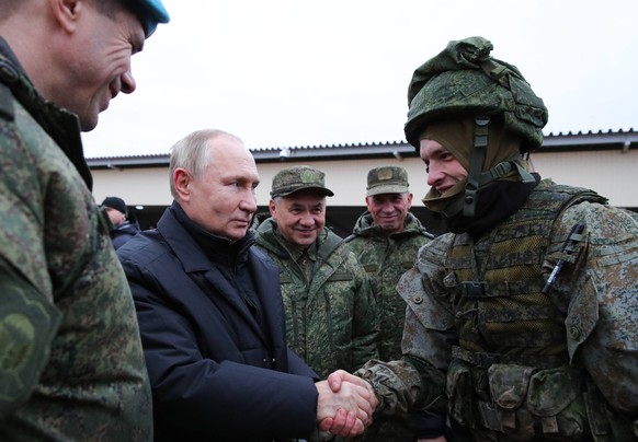 RUSSIA, RYAZAN REGION - OCTOBER 20, 2022: Russia s President Putin 2nd L and Russia s Defence Minister Sergei Shoigu 3rd L visit a Western Military District military training ground to inspect joint c ...