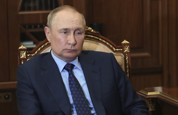 Russian President Vladimir Putin attends a meeting in Moscow, Russia, Thursday, Aug. 25, 2022. Russian President Vladimir Putin has ordered the Russian military to increase the size of the country's a ...