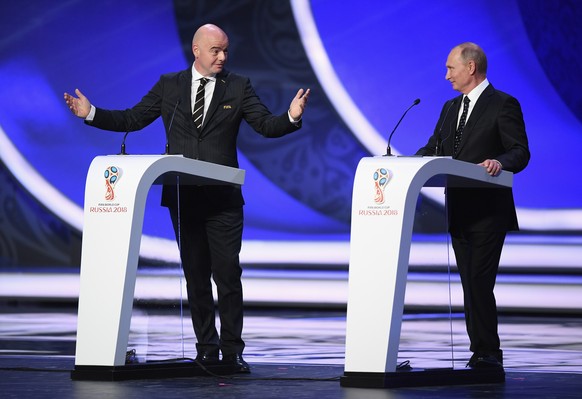 MOSCOW, RUSSIA - DECEMBER 01: FIFA President, Gianni Infantino (L) and Vladimir Putin President of Russia (R) speaks to the crowd during the Final Draw for the 2018 FIFA World Cup Russia at the State  ...