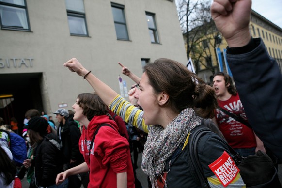 MUNICH, GERMANY - NOVEMBER 17: Students shout slogans as they walk past the university of technology during a protest march on November 17, 2009 in Munich, Germany. Following massive protests this sum ...