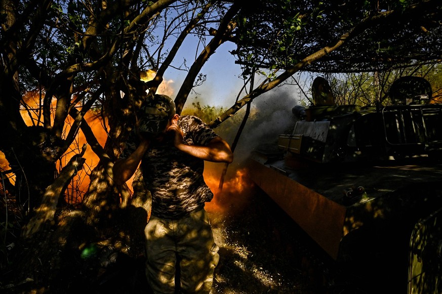 Ukrainian artillery unit near Chasiv Yar A serviceman of the 24th King Danylo Separate Mechanized Brigade is covering his ears during a combat mission near Chasiv Yar, Bakhmut district, in Donetsk reg ...