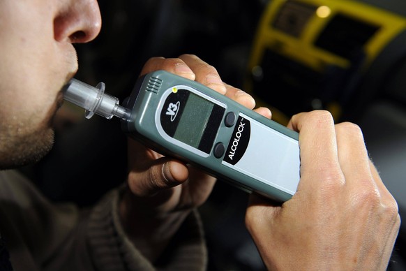 - MECHELEN, BELGIUM: Illustration picture shows a man demonstrating an alcolock , Monday 28 April 2008 in Mechelen. The driver of the car has to breath into the alcolock prior to start the car. If the ...