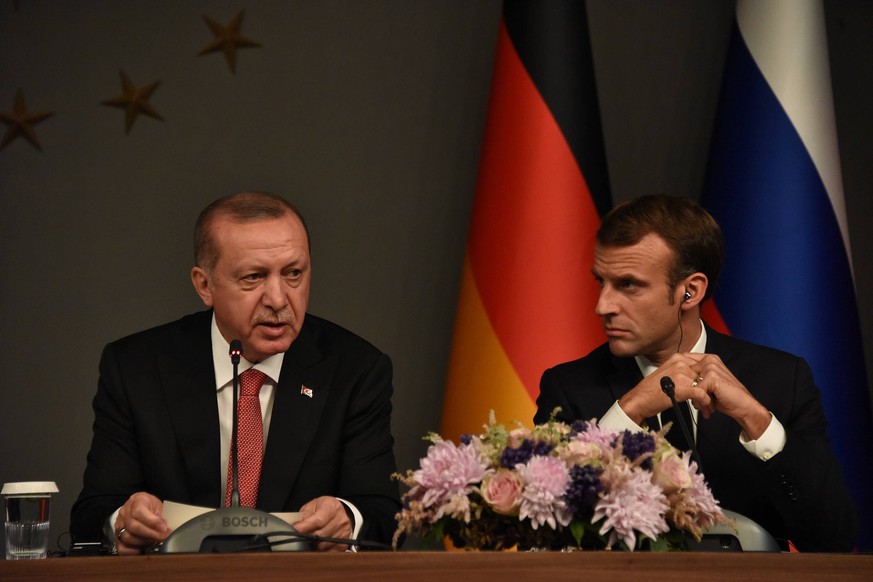 Turkey President Recep Tayyip Erdogan and French President Emmanuel Macron attends a news conference following their summit on Syria, in Istanbul, Saturday, Oct. 27, 2018. The leaders of Turkey, Russi ...