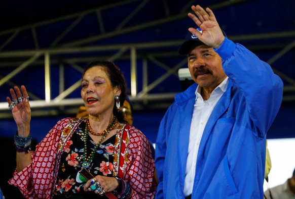 Nicaragua's President Daniel Ortega and Vice-President Rosario Murillo wave to supporters during celebrations to mark the 39th anniversary of the "Repliegue" (Withdrawal) in Managua, Nicarag ...