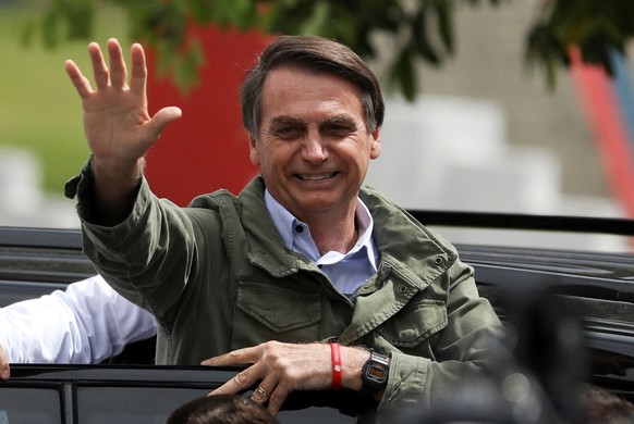 Jair Bolsonaro, far-right lawmaker and presidential candidate of the Social Liberal Party (PSL), gestures at a polling station in Rio de Janeiro, Brazil October 28, 2018. REUTERS/Pilar Olivares TPX IM ...