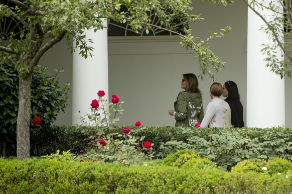 First lady Melania Trump walks down the Colonnade into the West Wing as she arrives at the White House, in Washington, Thursday, June 21, 2018, after visiting the Upbring New Hope Children Center run  ...