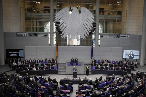 Britain&#039;s King Charles III, center, addresses the Bundestag, Germany&#039;s Parliament, in Berlin, Thursday, March 30, 2023. King Charles III arrived Wednesday for a three-day official visit to G ...