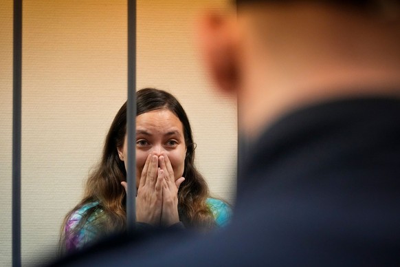 Sasha Skochilenko, a 33 year-old artist and musician cries standing behind bars in the court room in the Vasileostrovsky district court in St. Petersburg, Russia, Thursday, Nov. 16, 2023. Skochilenko  ...