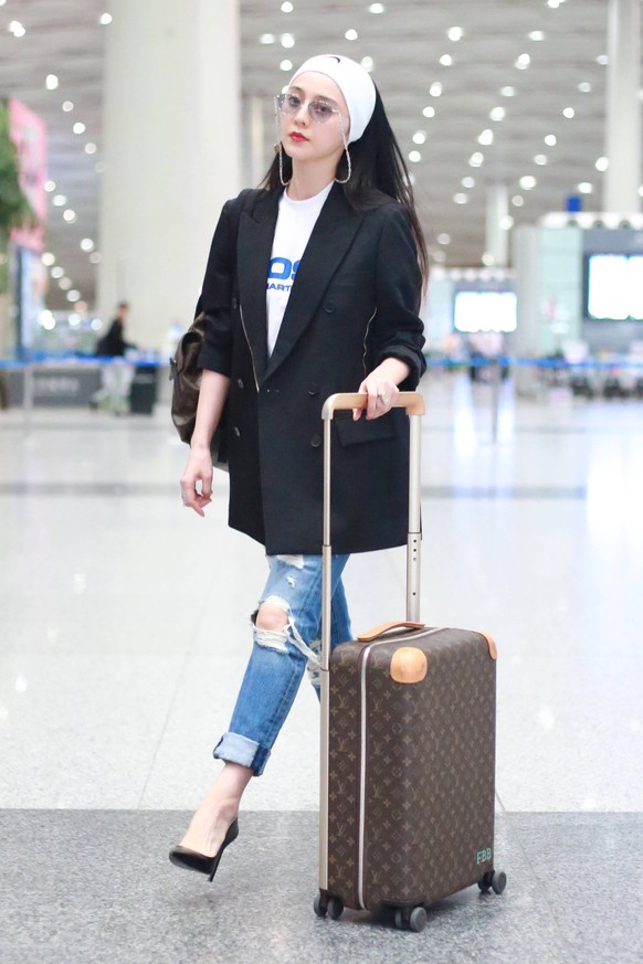 Chinese actress Fan Bingbing arrives at the Beijing Capital International Airport for the 71st Cannes Film Festival in Beijing, China, 8 May 2018. Fan Bingbing flashes fashion chic look at Beijing air ...