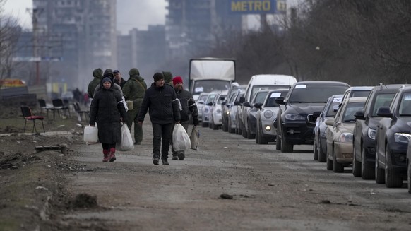 MARIUPOL, UKRAINE - MARCH 20: Civilians trapped in Mariupol city under Russian attacks, are evacuated in groups under the control of pro-Russian separatists, through other cities, in Mariupol, Ukraine ...