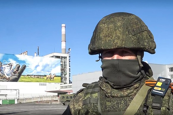 PRIPYAT, UKRAINE - FEBRUARY, 2022: Pictured in this video screen grab is a soldier at the Chernobyl Nuclear Power Plant. Russian Airborne troops and the Ukrainian National Guard are providing security ...