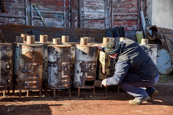 November 8, 2022, Lviv, Ukraine: A worker of one of the Lviv utility companies checks ready-made special metal stoves for heating basements and bomb shelters. Due to the threat of disruption of the he ...