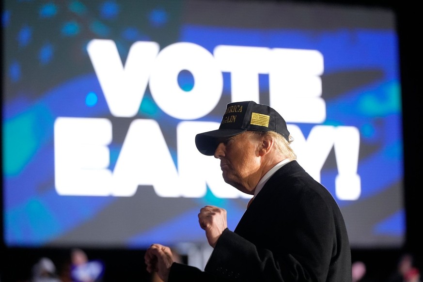 Republican presidential nominee former President Donald Trump gestures to supporters after speaking at a campaign rally at Cherry Capital Airport, Friday, Oct. 25, 2024, in Traverse City, Mich. (AP Ph ...