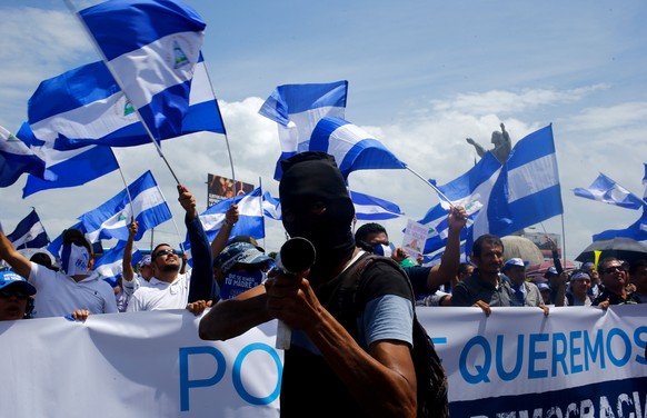 A demonstrator holds a homemade mortar during a march called "Together we are a volcano" against Nicaragua's President Daniel Ortega's government, in Managua, Nicaragua July 12, 2018. REUTER ...
