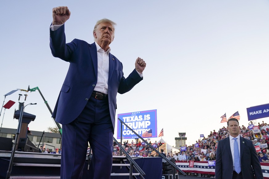 FILE - Former President Donald Trump dances during a campaign rally after speaking at Waco Regional Airport, March 25, 2023, in Waco, Texas. As Trump rails against possible indictment in New York, his ...