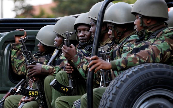 Kenyan policemen drive in their ruck as they arrive at the scene where explosions and gunshots were heard at the Dusit hotel compound, in Nairobi, Kenya January 16, 2019. REUTERS/Thomas Mukoya