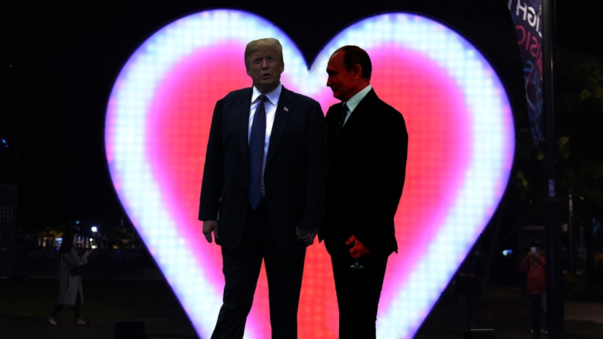 A couple shout &quot;I love you&quot; as a giant heart-shaped Love-O-Meter is illuminated during the media preview of Vivid Sydney in Sydney on May 26, 2016. 
Vivid Sydney, an annual festival of light ...