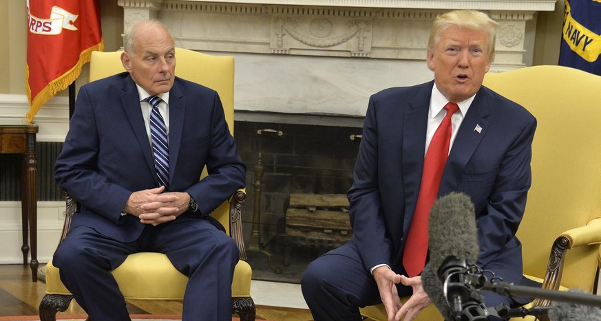 WASHINGTON, D.C. - JULY 31: (AFP-OUT) President Donald Trump (R) speaks to the press after the new White House Chief of Staff John Kelly (L) was sworn in, in the Oval Office of the White House, July 3 ...