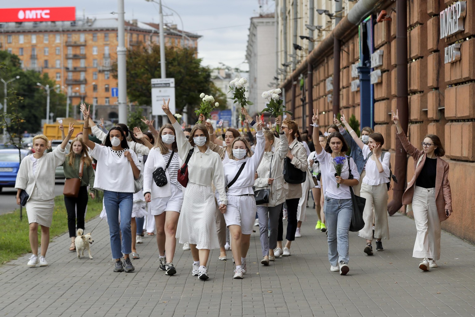 About 200 women march in solidarity with protesters injured in the latest rallies against the results of the country's presidential election in Minsk, Belarus, Wednesday, Aug. 12, 2020. Belarus offici ...