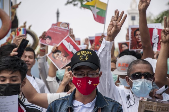 February 7, 2021, Bangkok, Thailand: Protesters making the three finger salute during the demonstration..Myanmar protesters rally outside The United Nation building UN in Bangkok against the Myanmar m ...
