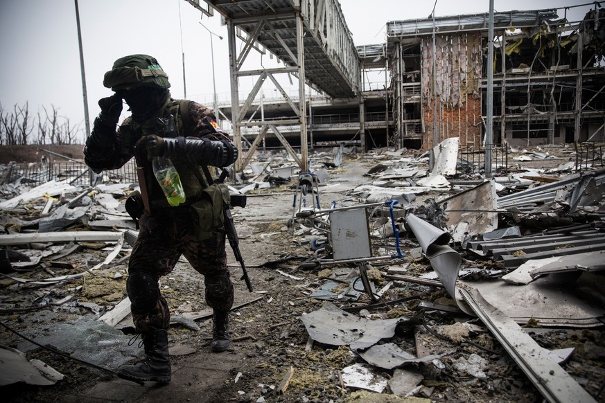 DONETSK, UKRAINE - FEBRUARY 26: A pro-Russian rebel walks amongst the wreckage of the destroyed Donetsk airport on February 26, 2015 in Donetsk, Ukraine. The Donetsk airport has been one of the most h ...