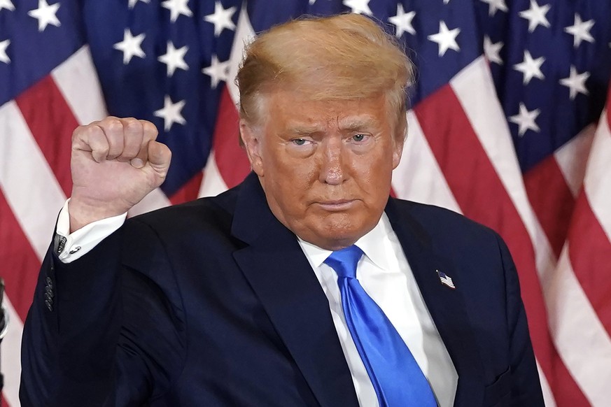FILE - President Donald Trump pumps his fist after speaking in the East Room of the White House, early Wednesday, Nov. 4, 2020, in Washington. Trump is already laying a sweeping set of policy goals sh ...