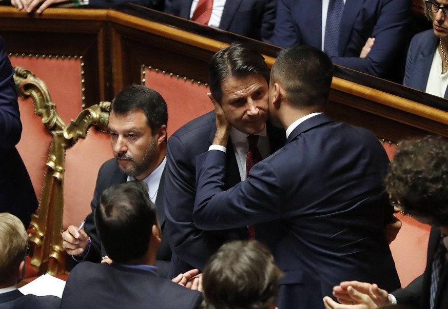 Italian Prime Minister Giuseppe Conte kisses and embraces italian Minister of Economic Development and Minister of Labor and Social Policy Luigi Di Maio during communications in the Senate. Rome, 20 A ...