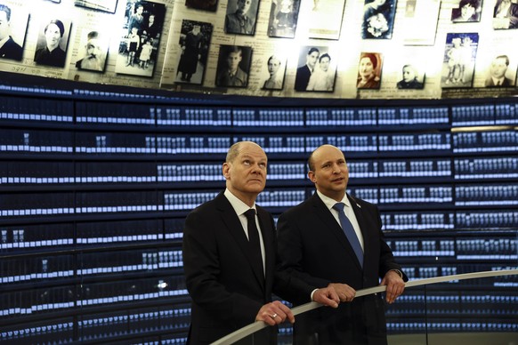 German Chancellor Olaf Scholz and Israeli Prime Minister Naftali Bennett visit the Hall of Names in a ceremony commemorating the six million Jews killed by the Nazis in the Hall of Remembrance at Yad  ...