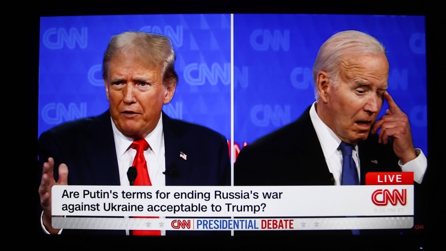 June 28, 2024, Atlanta, United States: This photo taken from a screen shows the first presidential debate between US President Joe Biden and former President Donald Trump in the CNN studio in Atlanta. ...