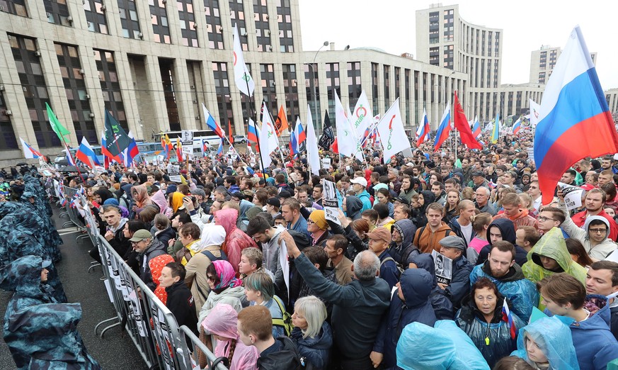 MOSCOW, RUSSIA - AUGUST 10, 2019: People take part in a rally in support of rejected independent candidates in the upcoming Moscow City Duma Moscow parliament election, in central Moscow. Sergei Savos ...