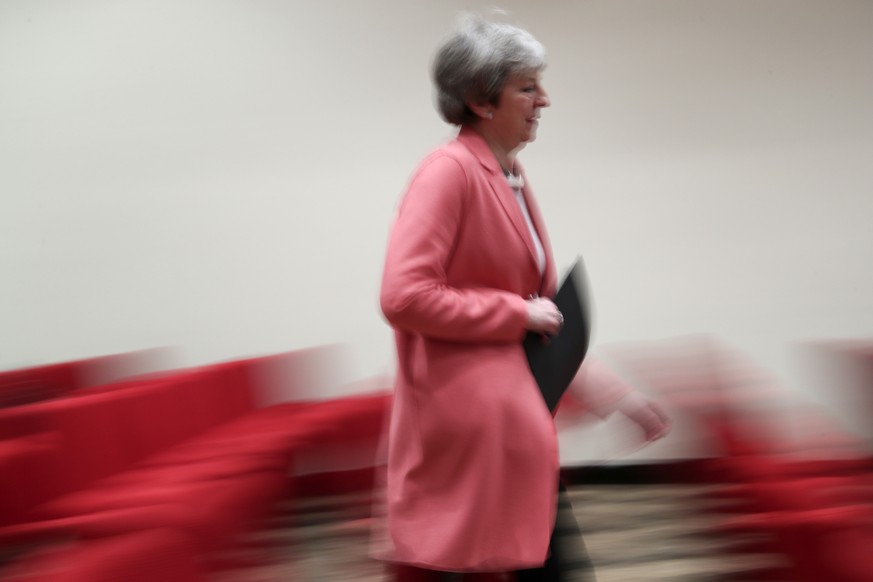 British Prime Minister Theresa May makes her way to a media conference at the conclusion of an EU-Arab League summit at the Sharm El Sheikh convention center in Sharm El Sheikh, Egypt, Monday, Feb. 25 ...