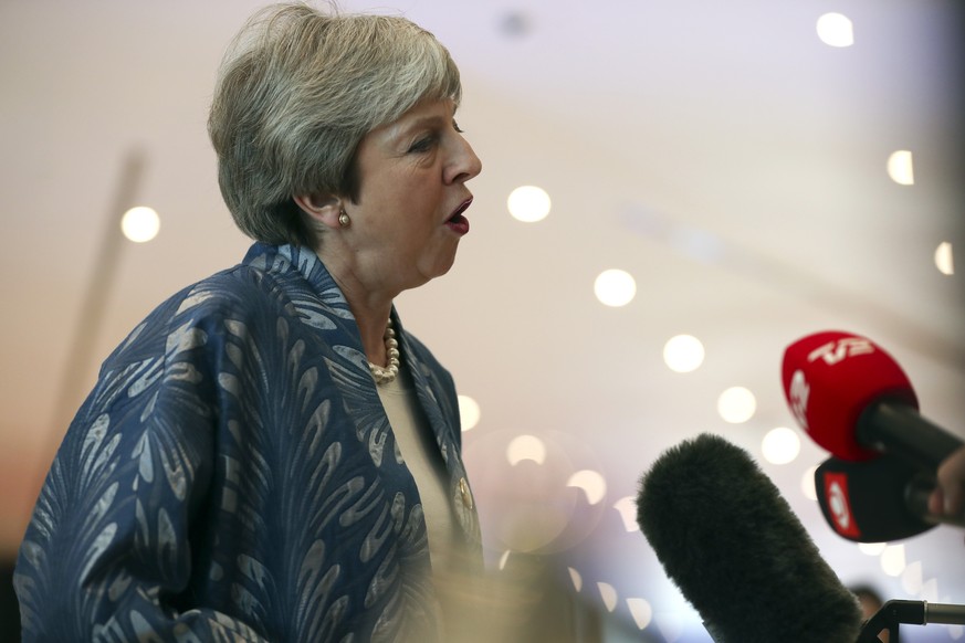 British Prime Minister Theresa May speaks with the media as she arrives for an EU-Arab summit at the Sharm El Sheikh convention center in Sharm El Sheikh, Egypt, Sunday, Feb. 24, 2019. British Prime M ...