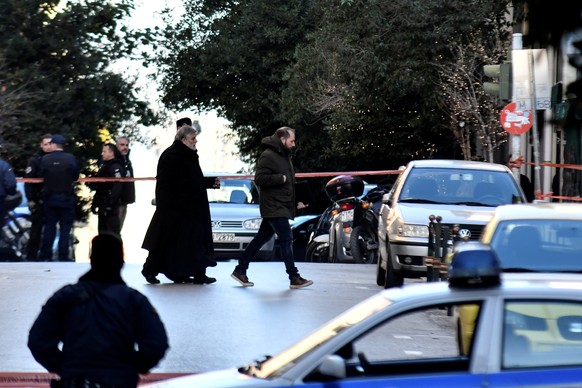 A Greek Orthodox priest arrives at the Saint Dionysios church, following the detonation of an explosive device in Athens, Greece, December 27, 2018. REUTERS/Michalis Karagiannis