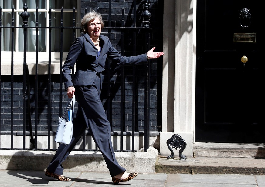 FILE PHOTO: Britain's Home Secretary Theresa May leaves after a cabinet meeting at number 10 Downing Street in London, Britain, July 12, 2016. REUTERS/Peter Nicholls/File Photo
