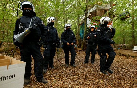 Police clear the area at the &quot;Hambacher Forst&quot; in Hambach near Cologne, Germany, September 5, 2018, where protesters have built a camp with tents and treehouses to stop the clearing of a for ...