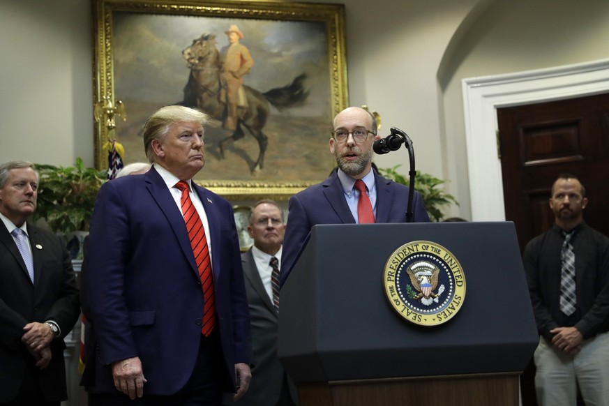 FILE - President Donald Trump listens as acting director of the Office of Management and Budget Russel Vought speaks during an event on &quot;transparency in Federal guidance and enforcement&quot; in  ...