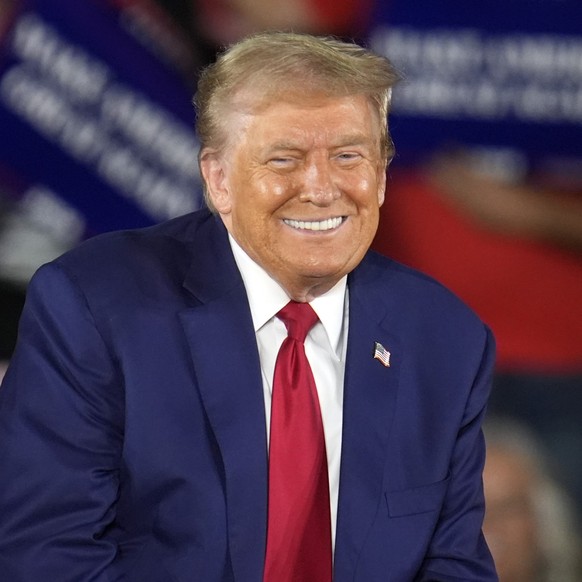 Republican presidential nominee former President Donald Trump smiles during a town hall event at Macomb Community College Friday, Sept. 27, 2024, in Warren, Mich. (AP Photo/Paul Sancya)