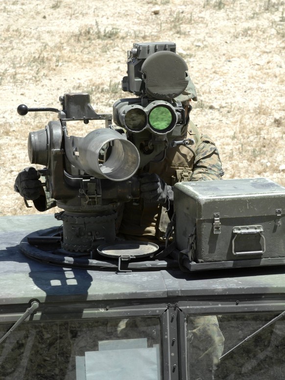 June 18, 2010 - A U.S. Marine looks though the optics of a BGM-71 TOW anti-tank guided missile while participating in convoy operations during Javelin Thrust 2010 at a range outside Hawthorne, Nevada. ...