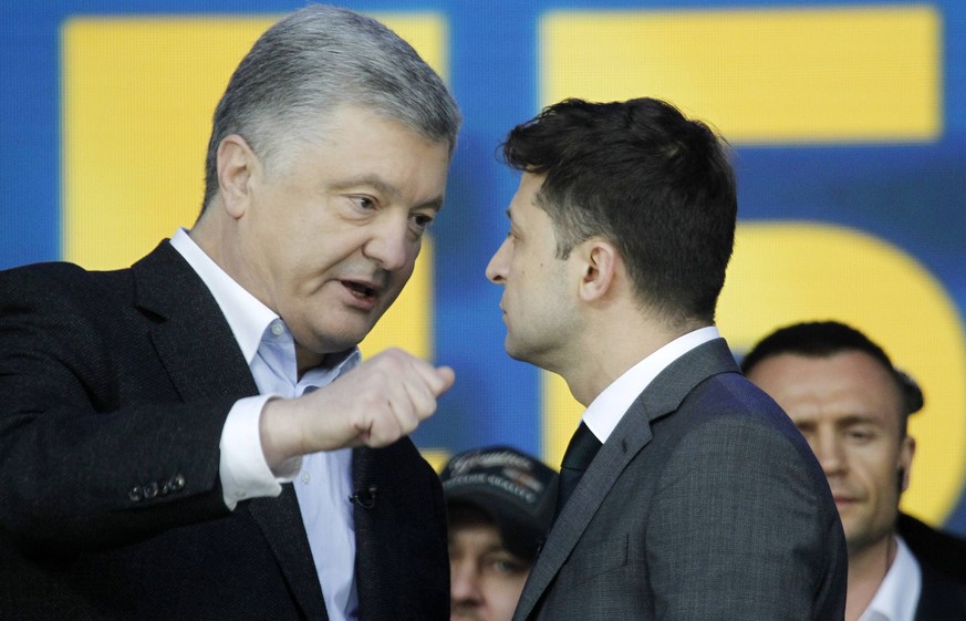 April 19, 2019 - Kiev, Ukraine - Ukrainian President and Presidential candidate PETRO POROSHENKO (L) and Ukrainian comedian actor and presidential candidate VOLODYMYR ZELENSKIY (R) speak during debate ...