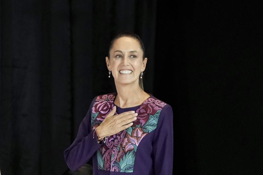 Ruling party presidential candidate Claudia Sheinbaum greets supporters after the National Electoral Institute announced she held an irreversible lead in the election in Mexico City, early Monday, Jun ...